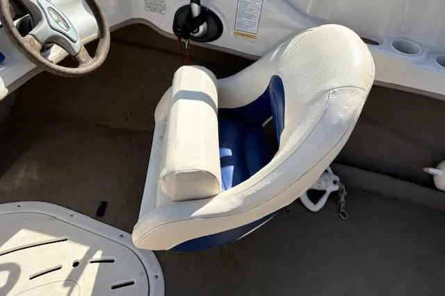Slide: The Image of 2008 Tahoe Q6 SF boat interior with steering wheel and cushioned seat. - 3