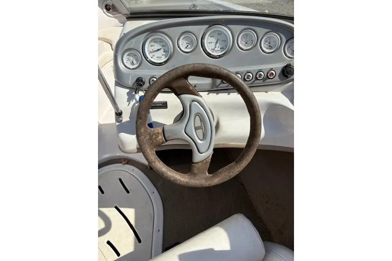 Slide: The Image of Steering wheel and dashboard of a 2008 Tahoe Q6 SF boat. - 7