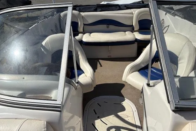 Slide: The Image of Interior of a 2008 Tahoe Q6 SF boat with white and blue seating. - 9