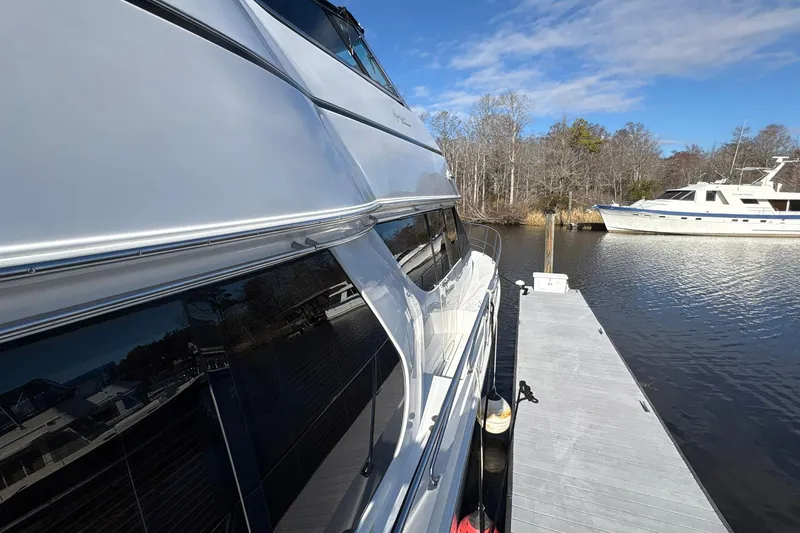 Slide: The Image of 1999 Carver 530 Voyager Pilothouse yacht docked on a sunny day. - 15