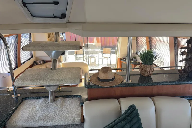 Slide: The Image of Interior of 1999 Carver 530 Voyager Pilothouse with elegant decor and seating. - 32