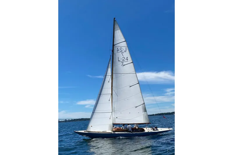 Slide: The Image of Sailing on a Luders 24 yacht from 1944, under clear blue skies. - 2