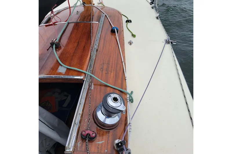 Slide: The Image of Wooden deck of a 1944 Luders 24 sailboat with ropes and winch. - 8