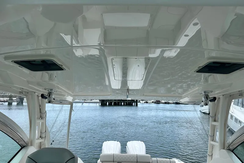 Slide: The Image of 2023 Pursuit DC 295 Dual Console boat interior with water view. - 21