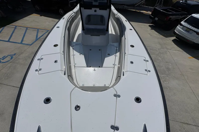 Slide: The Image of 2025 Cape Horn 32 XS boat deck, spacious and sleek design in a parking area. - 21