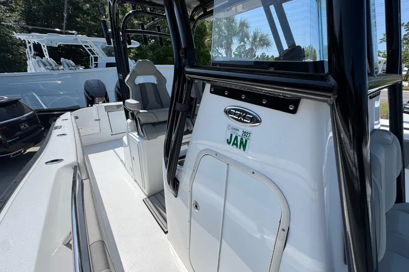 Slide: The Image of Cape Horn 32 XS boat, 2025 model, sleek design with modern seating and controls. - 26