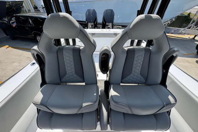 Slide: The Image of Luxury seating on 2025 Cape Horn 32 XS boat, featuring sleek gray upholstery. - 33