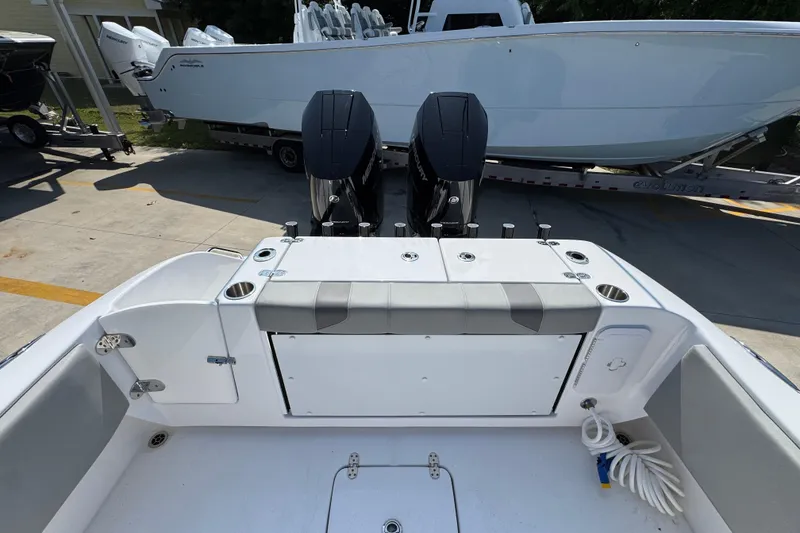 Slide: The Image of 2025 Cape Horn 32 XS boat with dual engines, docked on a trailer. - 40