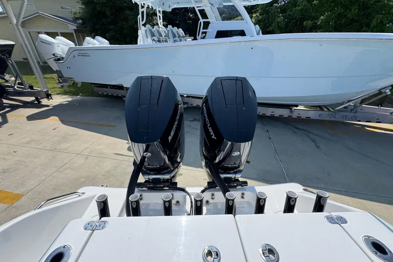 Slide: The Image of 2025 Cape Horn 32 XS boat with dual Mercury engines on a trailer. - 41