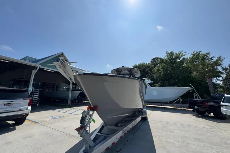 Slide: The Image of 2025 Cape Horn 32 XS boat on trailer in sunny outdoor setting. - 5