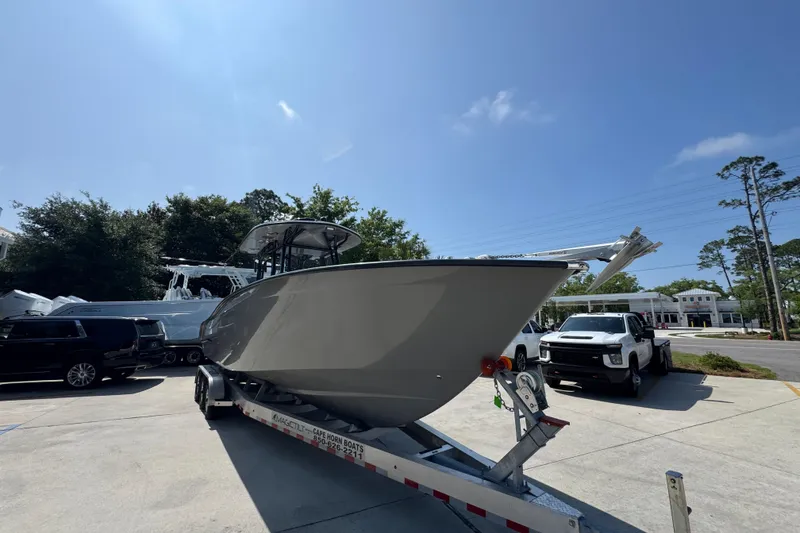 Slide: The Image of 2025 Cape Horn 32 XS boat on trailer in sunny outdoor setting. - 7