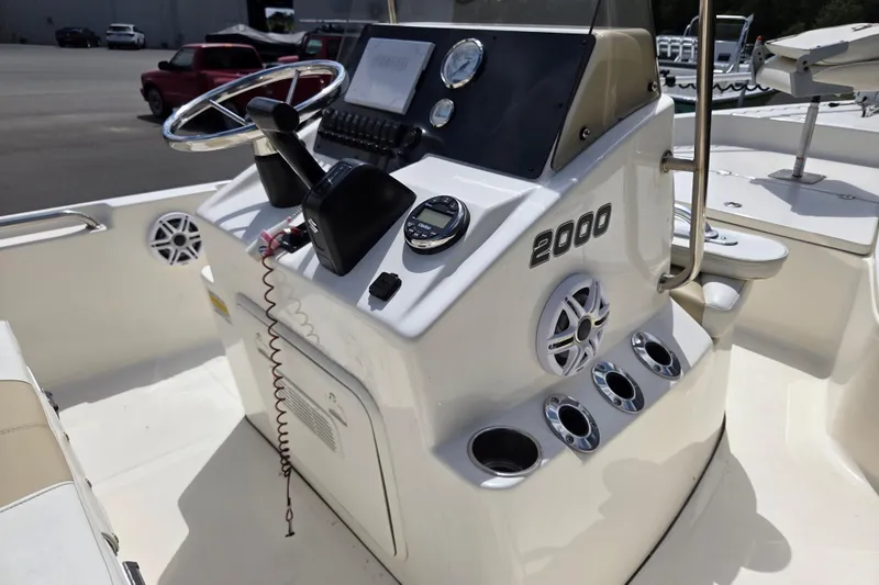 Slide: The Image of 2023 Bulls Bay 2000 boat console with steering wheel and controls. - 10