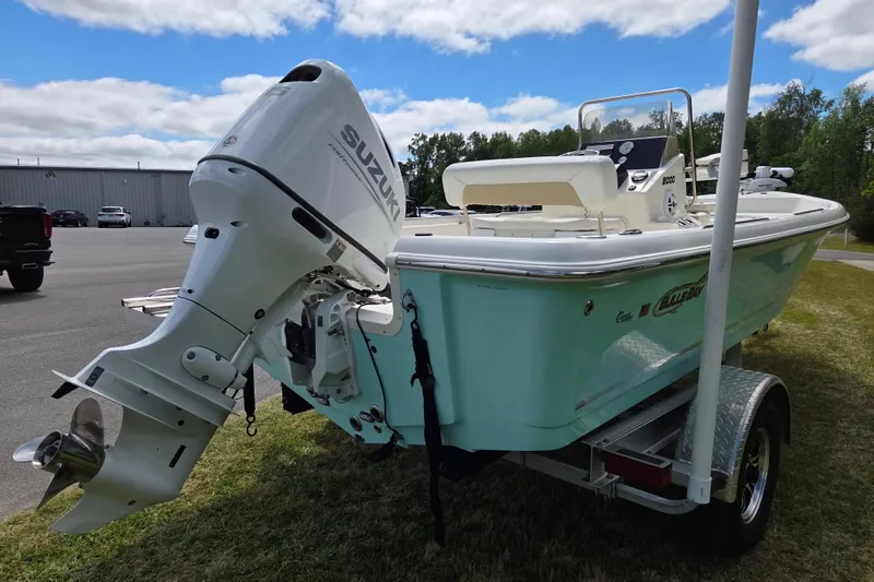 Slide: The Image of 2023 Bulls Bay 2000 boat with Suzuki outboard motor on trailer, parked outdoors. - 4