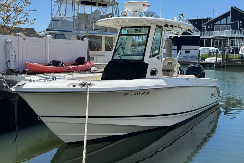 The Image of 2017 Boston Whaler 250 Outrage boat docked in a marina. - 0