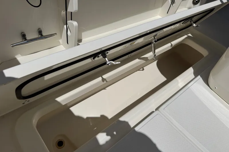 Slide: The Image of Open storage compartment on a 2017 Boston Whaler 250 Outrage boat. - 19