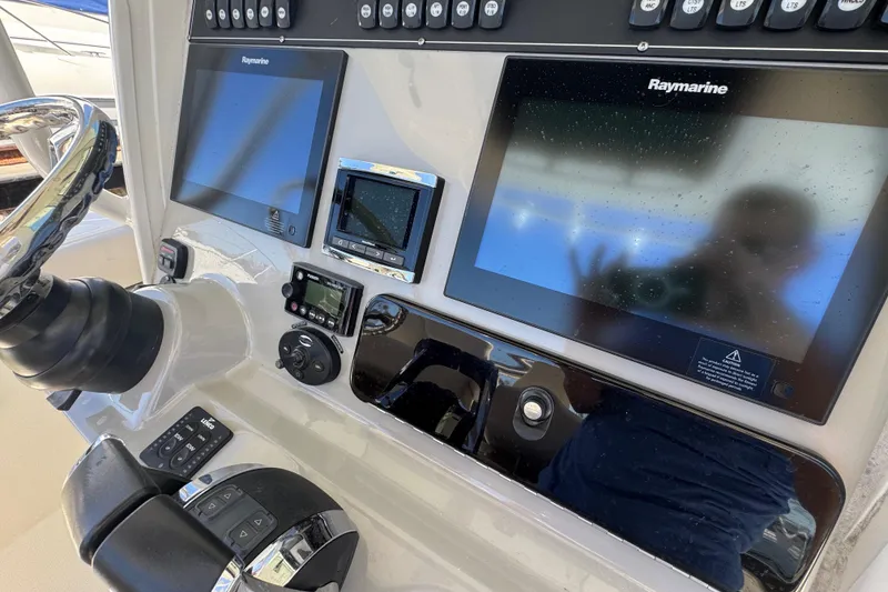 Slide: The Image of Control panel of a 2017 Boston Whaler 250 Outrage with Raymarine displays. - 7