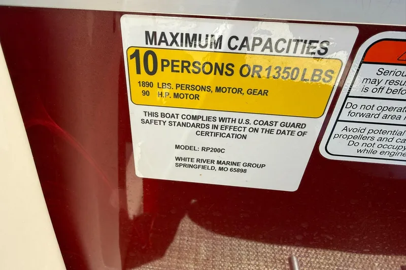 Slide: The Image of Boat capacity label for 2022 Ranger 200C, 10 persons or 1350 lbs, 90 HP motor. - 15