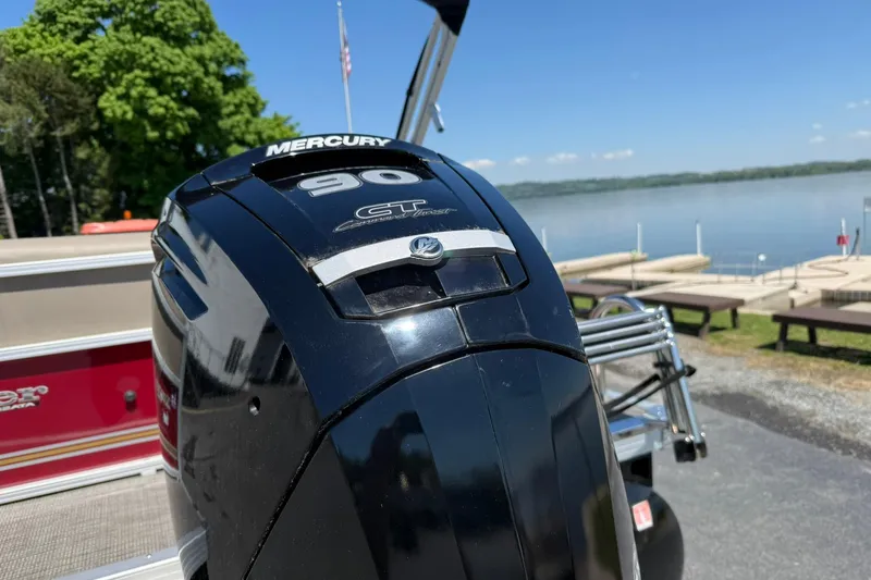 Slide: The Image of Mercury 90 GT outboard motor on 2022 Ranger 200C boat by a lake. - 4