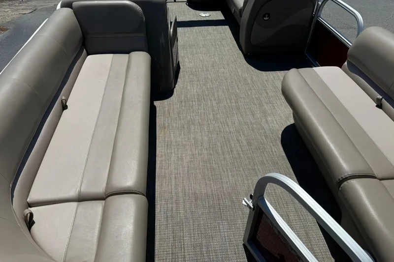 Slide: The Image of Interior of 2022 Ranger 200C boat with beige seating and carpeted floor. - 7