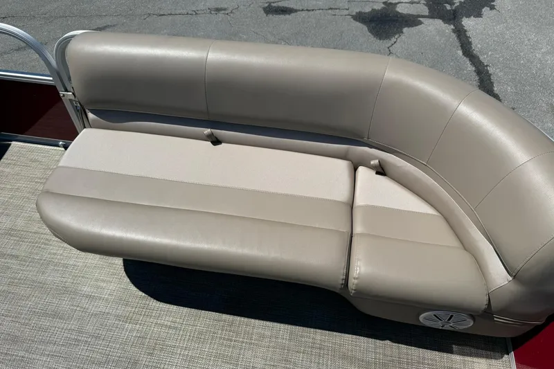 Slide: The Image of Beige leather seating on 2022 Ranger 200C boat, featuring curved design and speaker. - 9