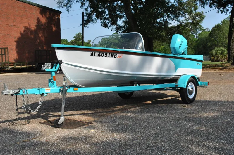 Slide: The Image of 2025 Starcraft 57 Ski Champ boat on trailer, parked outdoors. - 14