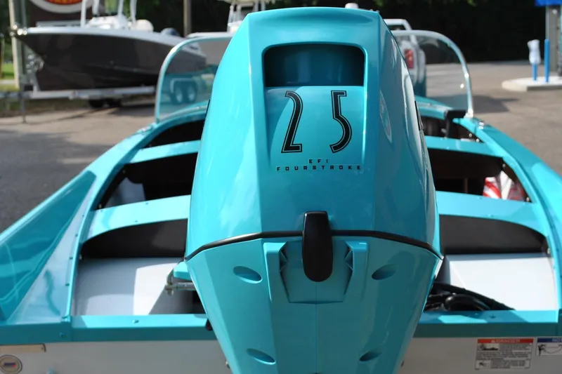 Slide: The Image of Turquoise Starcraft 57 Ski Champ 2025 boat with 25 EFI Fourstroke engine. - 17