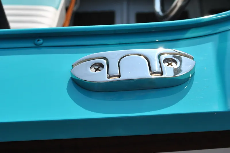 Slide: The Image of Chrome cleat on turquoise Starcraft 57 Ski Champ boat, 2025 model. - 18