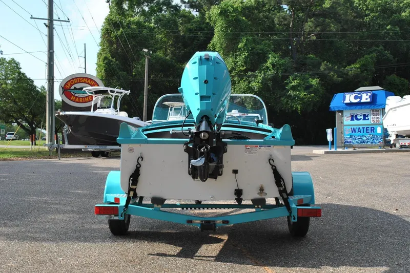 Slide: The Image of 2025 Starcraft 57 Ski Champ boat on trailer at Sportsman Marine dealership. - 6