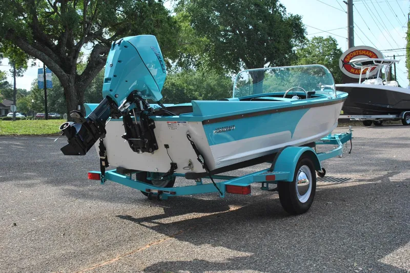 Slide: The Image of 2025 Starcraft 57 Ski Champ boat on trailer, parked outdoors. - 8