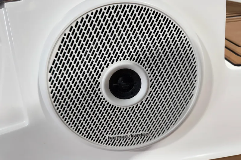 Slide: The Image of Harman Kardon speaker on 2023 Cobalt R6 Surf boat, featuring a sleek white grille. - 11