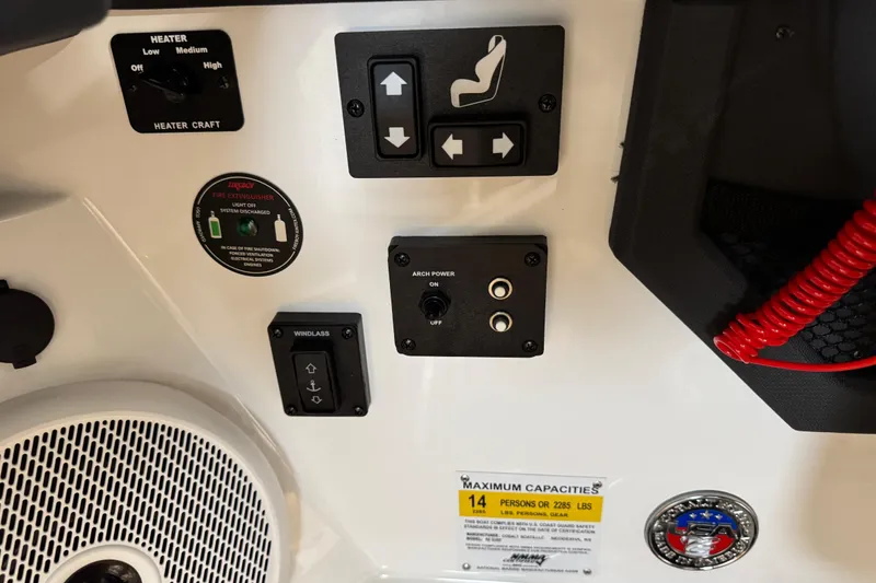Slide: The Image of Control panel of 2023 Cobalt R6 Surf boat with various switches and capacity label. - 15