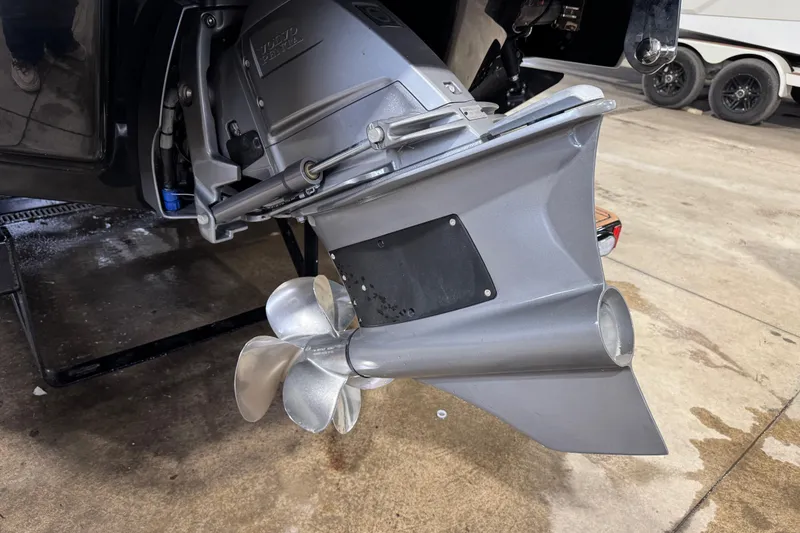 Slide: The Image of 2023 Cobalt R6 Surf boat propeller and drive system in a garage setting. - 7