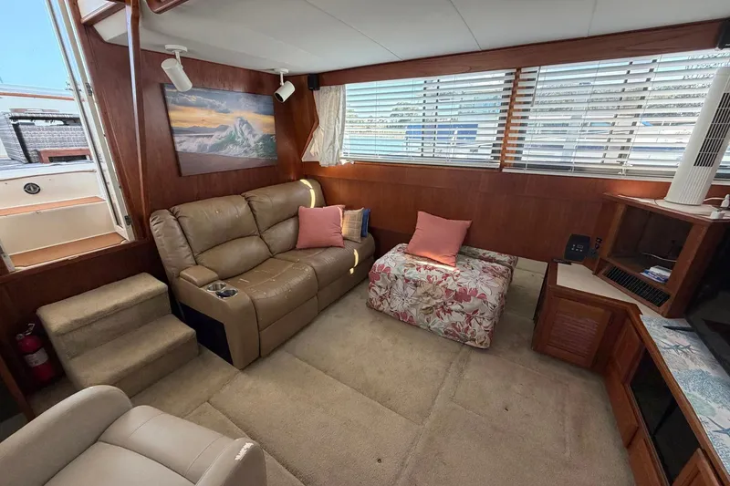 Slide: The Image of Interior of 1987 Viking 44 Motor Yacht with cozy seating and nautical decor. - 38