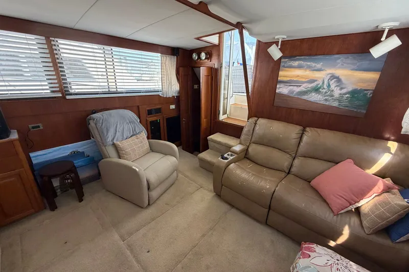 Slide: The Image of Interior of 1987 Viking 44 Motor Yacht with comfortable seating and nautical decor. - 39