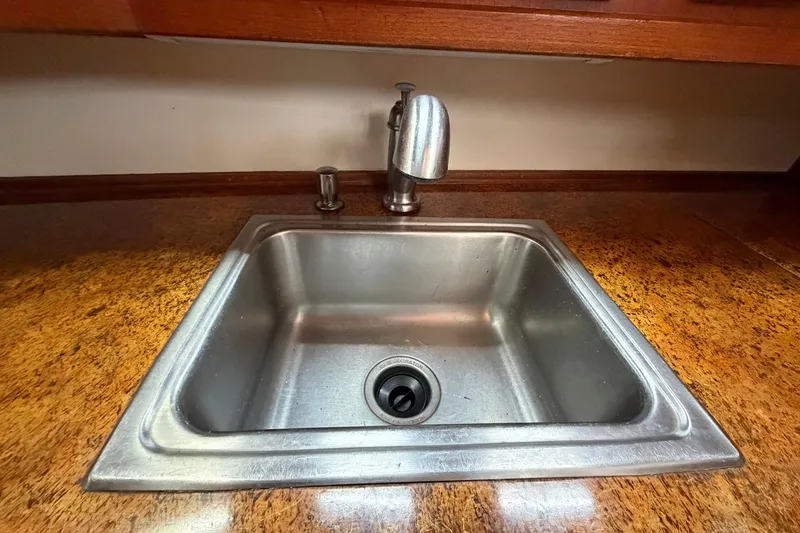 Slide: The Image of Stainless steel sink in 1987 Viking 44 Motor Yacht kitchen area. - 49