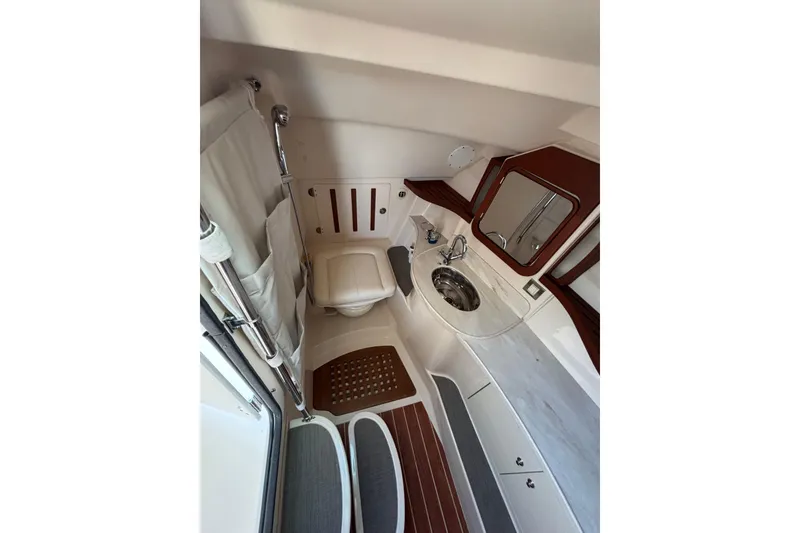 Slide: The Image of 2018 Grady-White Freedom 375 boat bathroom with sink, toilet, and mirror. - 12