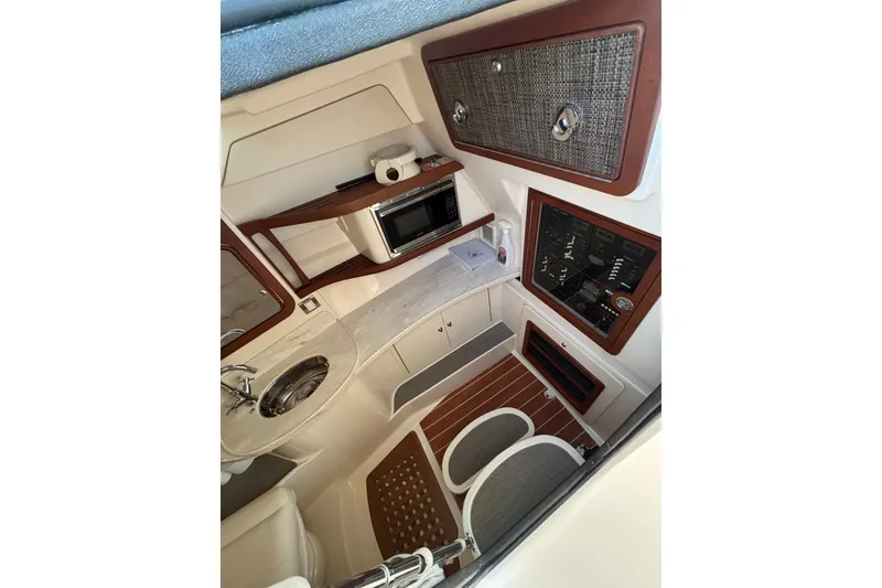 Slide: The Image of Interior of 2018 Grady-White Freedom 375 boat with kitchenette and control panel. - 13