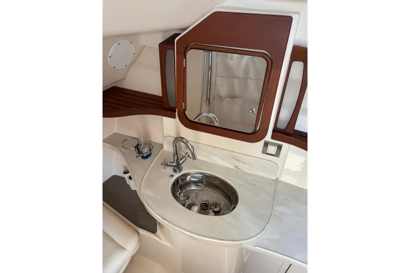 Slide: The Image of Luxurious 2018 Grady-White Freedom 375 boat interior with elegant sink and mirror. - 16
