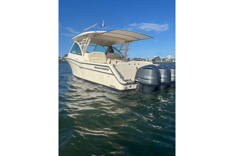 Slide: The Image of 2018 Grady-White Freedom 375 boat with Yamaha engines on the water. - 2