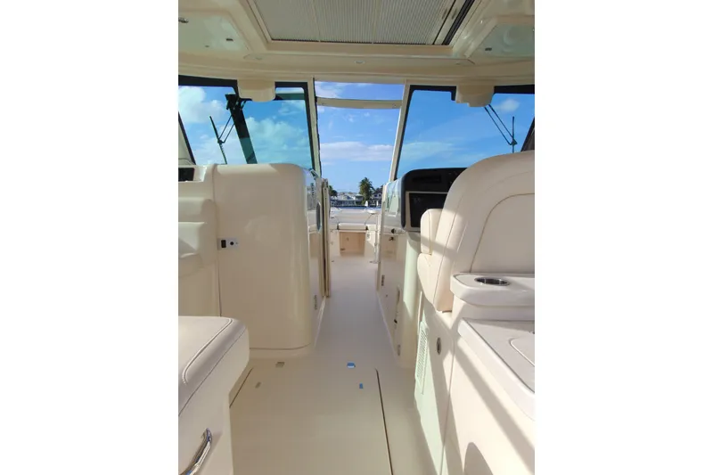 Slide: The Image of Interior view of 2018 Grady-White Freedom 375 boat, showcasing seating and helm area. - 4