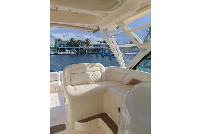 Slide: The Image of Interior view of 2018 Grady-White Freedom 375 boat with luxurious seating and waterfront backdrop. - 5