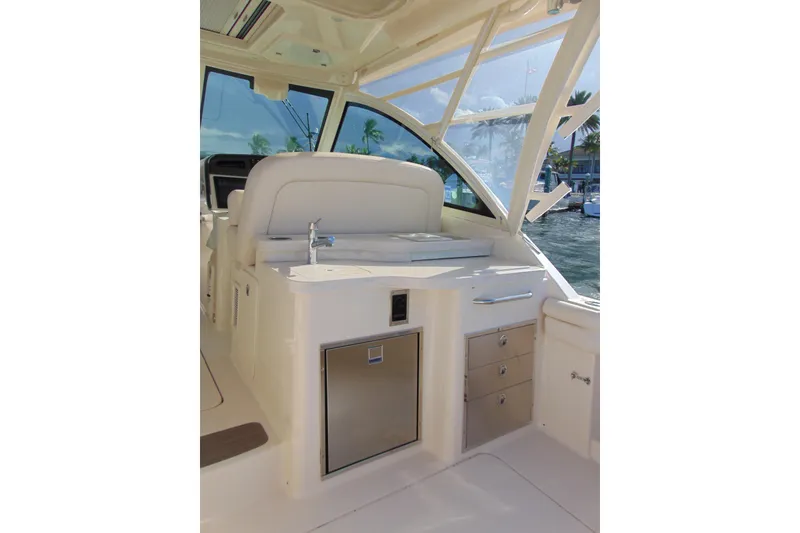 Slide: The Image of 2018 Grady-White Freedom 375 boat interior with sink and storage drawers. - 9