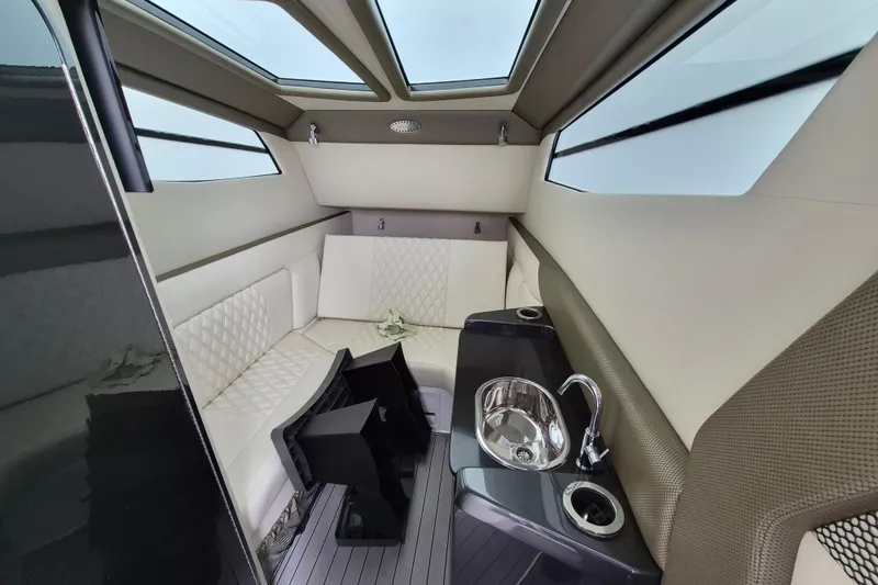 Slide: The Image of Luxurious interior of 2020 Nor-Tech 450 Sport Center Console with seating and sink. - 18