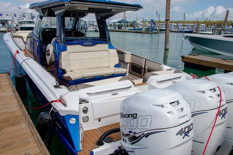Slide: The Image of Manufacturer Provided Image: 2020 Nor-Tech 450 Sport Center Console boat docked with triple 400R engines. - 4