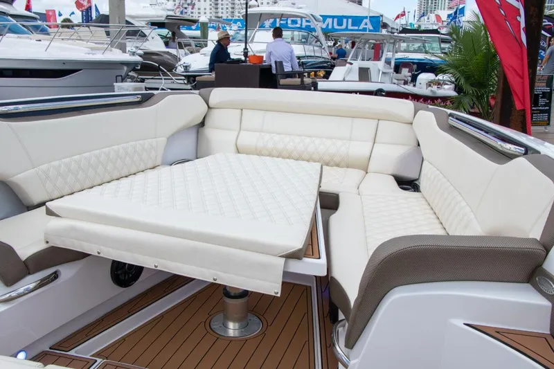 Slide: The Image of Manufacturer Provided Image: 2020 Nor-Tech 450 Sport Center Console boat with luxurious seating and table. - 6