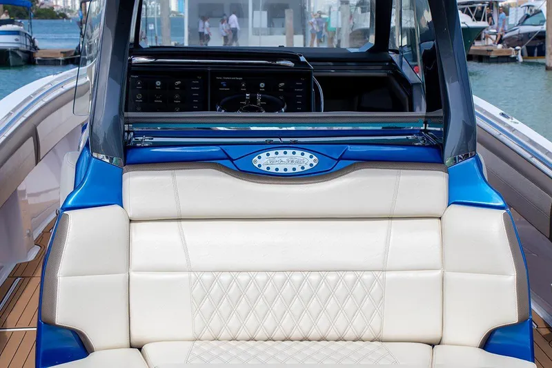 Slide: The Image of Manufacturer Provided Image: 2020 Nor-Tech 450 Sport Center Console boat interior with luxurious seating and modern dashboard. - 7