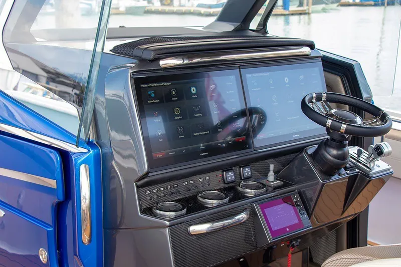 Slide: The Image of Manufacturer Provided Image: 2020 Nor-Tech 450 Sport Center Console helm with dual touchscreen displays and modern controls. - 8