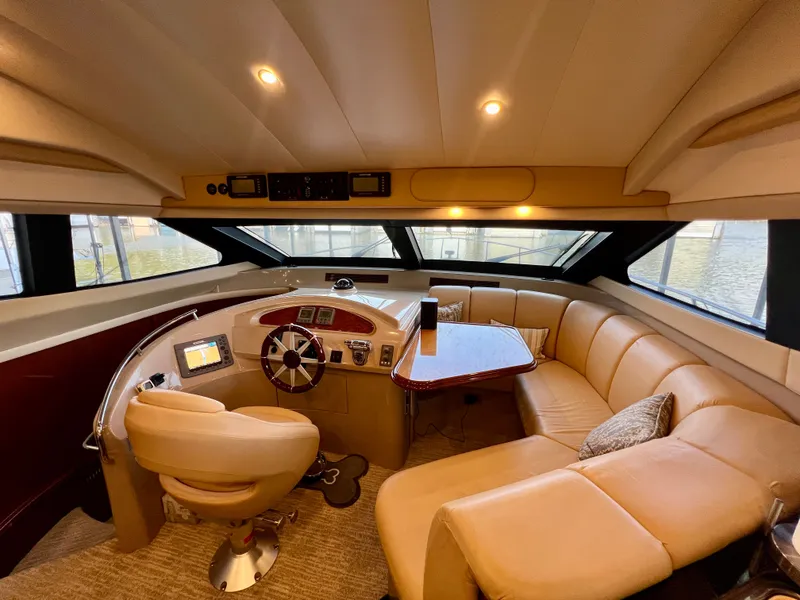 Slide: The Image of Luxurious interior of a 2005 Marquis 59 yacht with leather seating. - 12