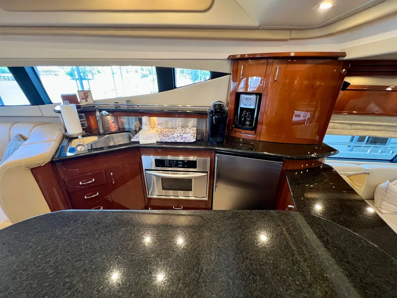Slide: The Image of Luxurious kitchen in a 2005 Marquis 59 yacht with modern appliances. - 13