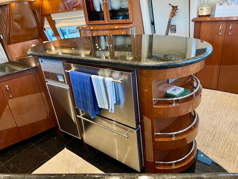 Slide: The Image of Luxurious kitchen in a 2005 Marquis 59 yacht with granite countertop. - 15